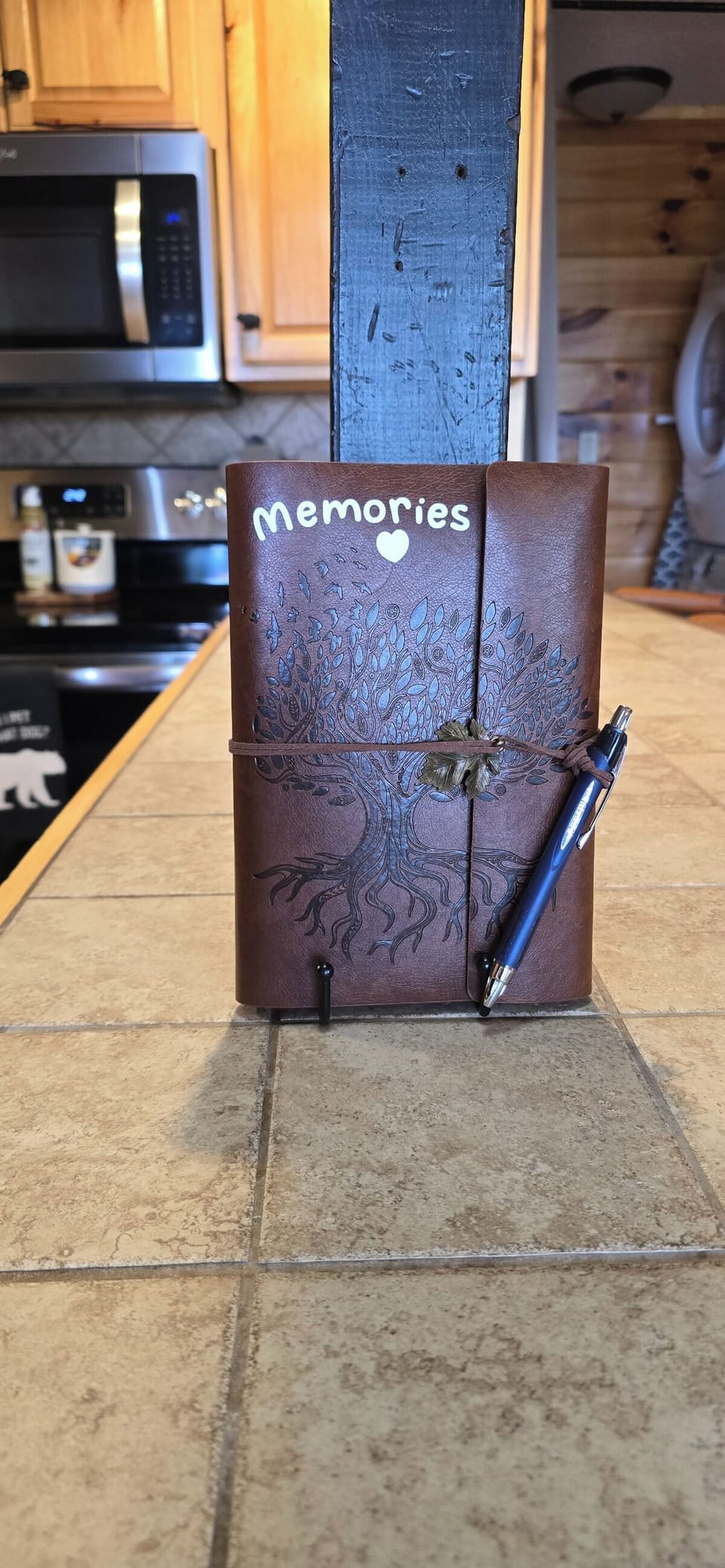 Document your stay in this charming leather journal for capturing special moments and memories.