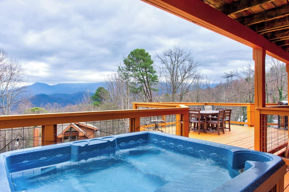 Soak in your bubbling hot tub while gazing at breathtaking mountain views from your covered deck.