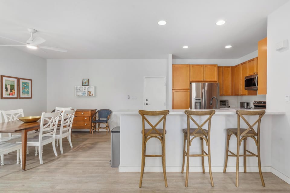 Your open-concept kitchen and dining space invites you to cook and gather with warm wood tones and modern amenities.