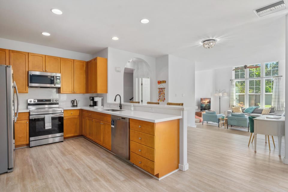 Your fully equipped kitchen flows seamlessly into the bright living space, perfect for cooking and entertaining together.