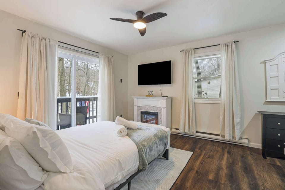 Spacious bedroom with a queen bed, perfect for a good night’s sleep.