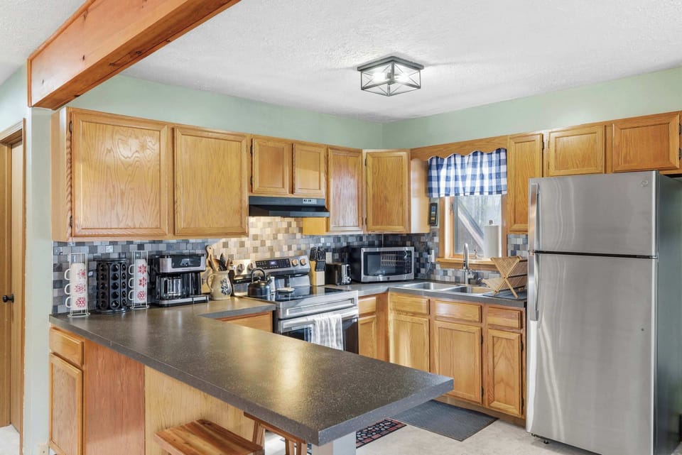 Fully equipped kitchen ready for home-cooked meals and family gatherings.