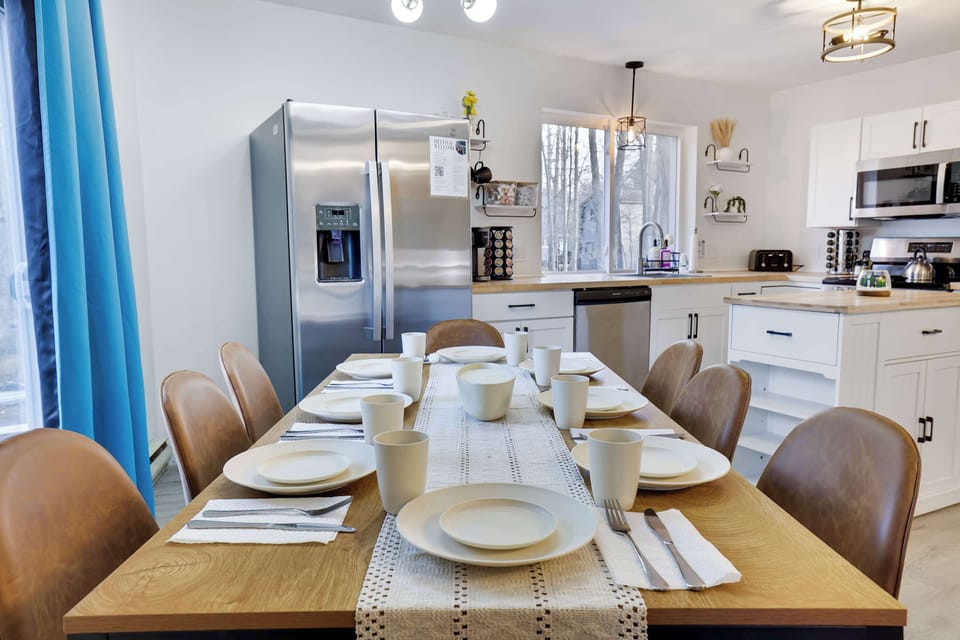 Gather around a stylish table, perfect for feasts and fun in a bright kitchen!