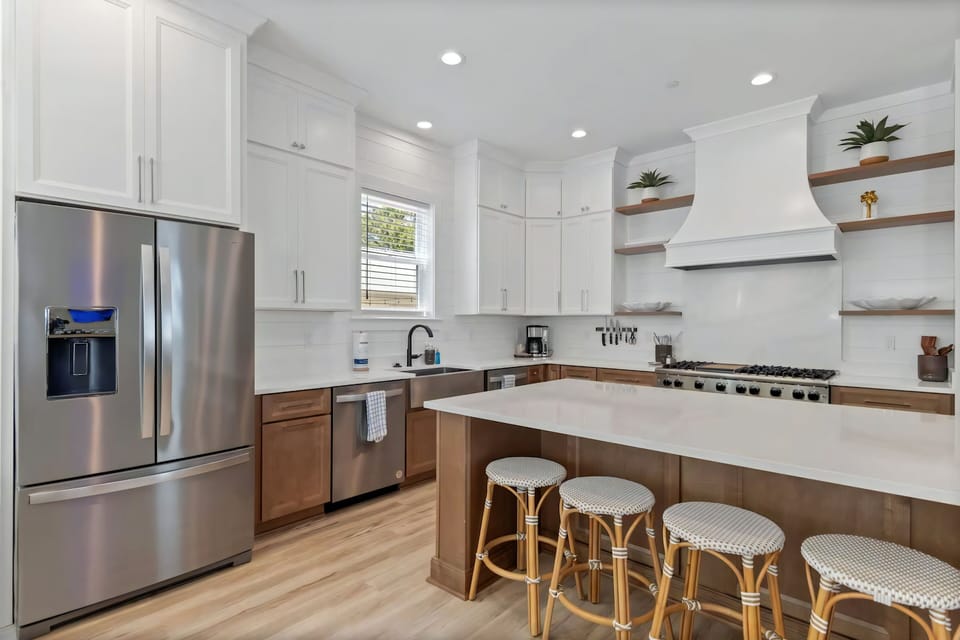 Warm wood tones and crisp white finishes create easy comfort.