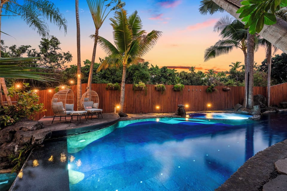 Your private tropical oasis awaits with a stunning heated pool with magical sunset lighting.