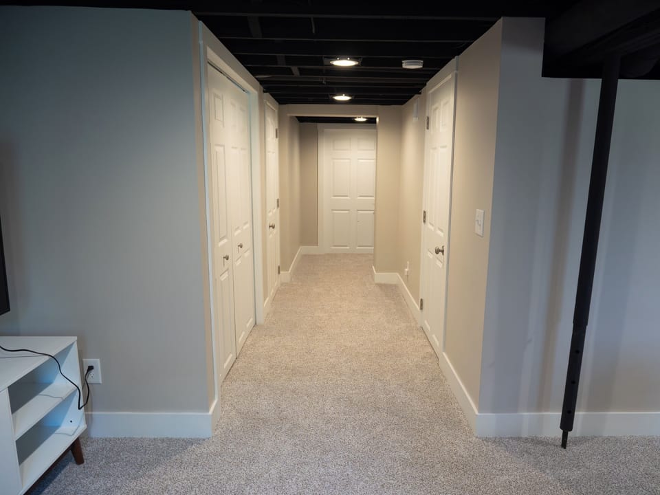 Lower-level hallway. Laundry in door on the left.