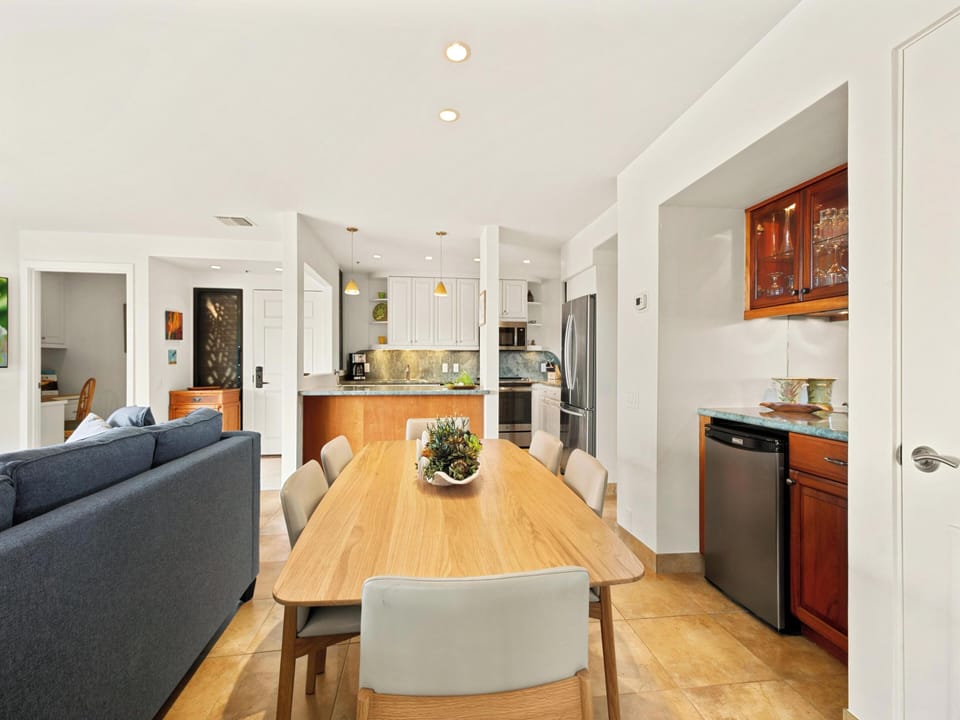Gather around the spacious dining table where meals become memories. This bright, open-plan space flows seamlessly from living room to kitchen, perfect for your group to cook, dine, and relax together.
