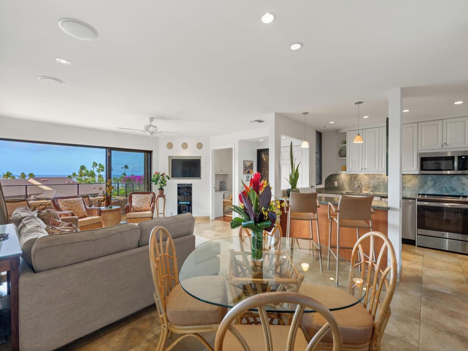 A fully equipped kitchen with high-end stainless steel appliances and a dedicated wet bar — everything you need to cook in or mix a drink and take it straight to the lanai.