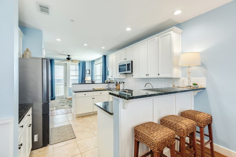 Nearby breakfast bar sits up to 3 more