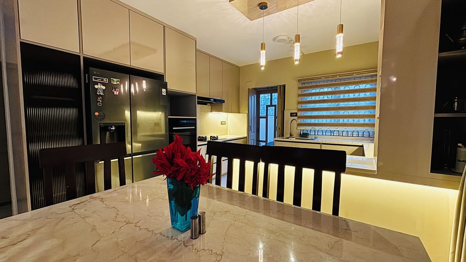An inviting dining space filled with natural light, featuring a spacious table.