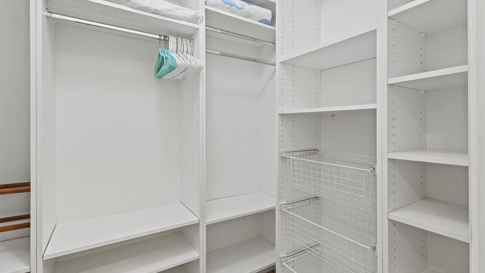 The master closet has extra storage for clothes.