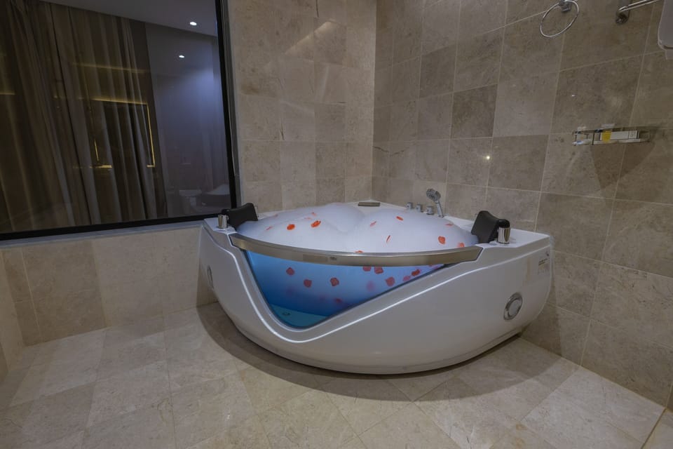 Honeymoon Studio, 1 Bedroom, Hot Tub, City View | Bathroom | Combined shower/tub, hair dryer, slippers, bidet
