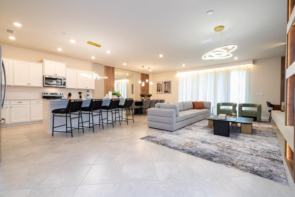 Spacious open-concept living room and kitchen with modern finishes