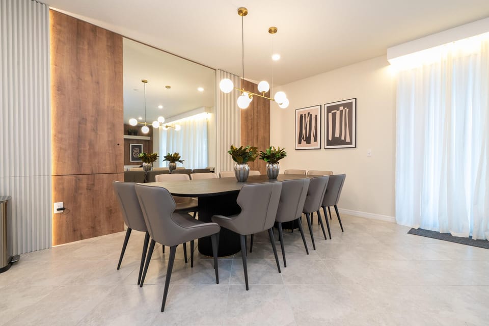 Elegant dining room with modern lighting and spacious seating