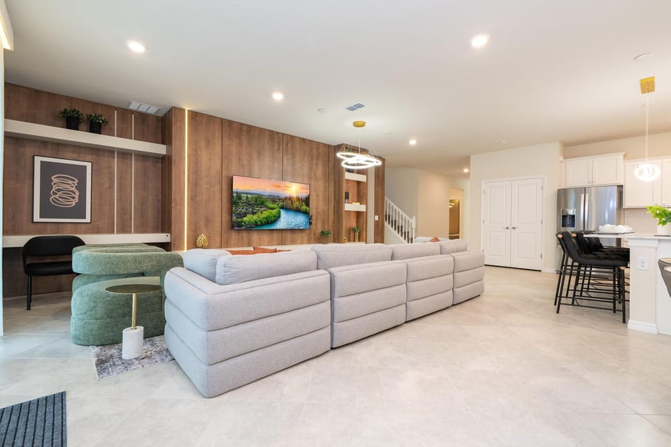 Spacious living room with cozy seating and modern entertainment