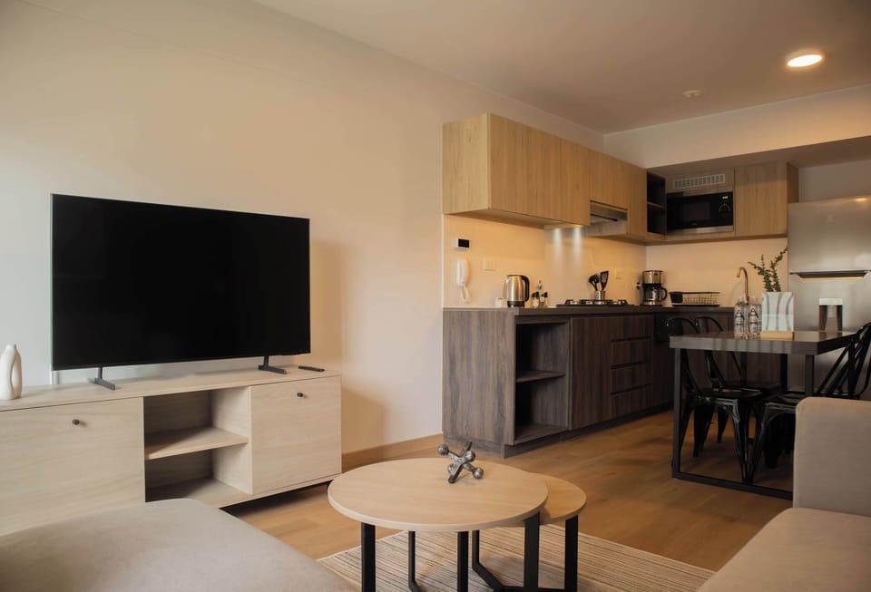 Living area featuring a large TV and open layout