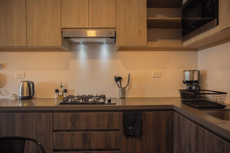 Additional kitchen view showcasing storage and cooking space