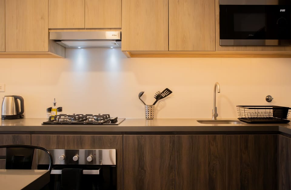 Additional kitchen view showcasing storage and cooking space.