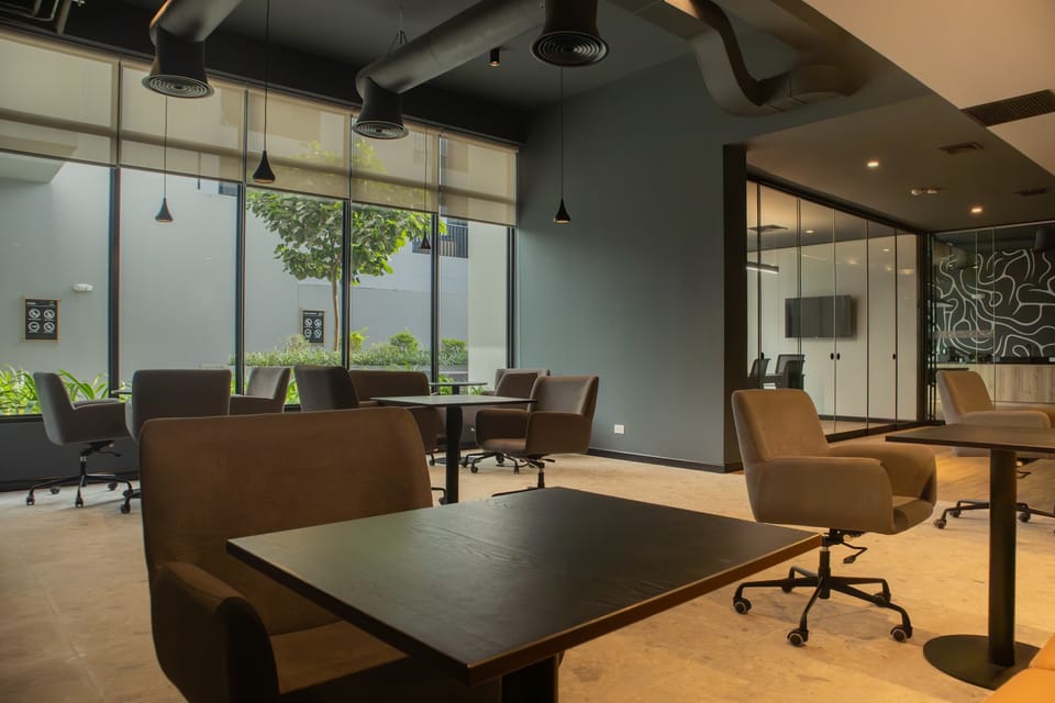 Office desks and ergonomic chairs.