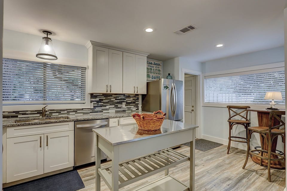 Fully stocked kitchen with all stainless steel appliances. Also, in the kitchen is a 2 seater coffee table.