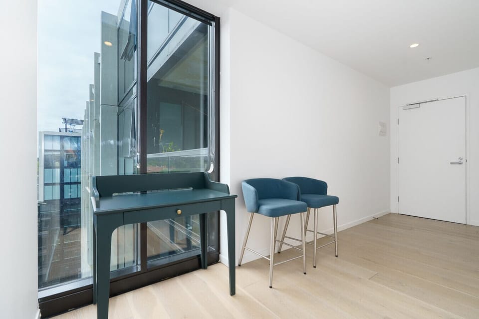 Clean, modern interiors throughout the apartment create a bright and welcoming atmosphere.