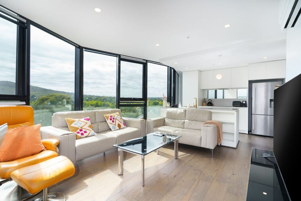 Settle into the comfortable living area and enjoy the open views. A bright, welcoming space to unwind, read, or spend time together.