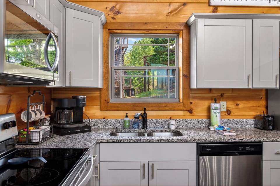 Bright and modern kitchen featuring a well-organized layout with quality finishes, creating a welcoming space for cooking, dining, and gathering.
