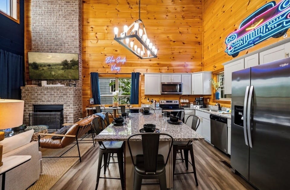 Open concept living room and kitchen with vaulted ceiling