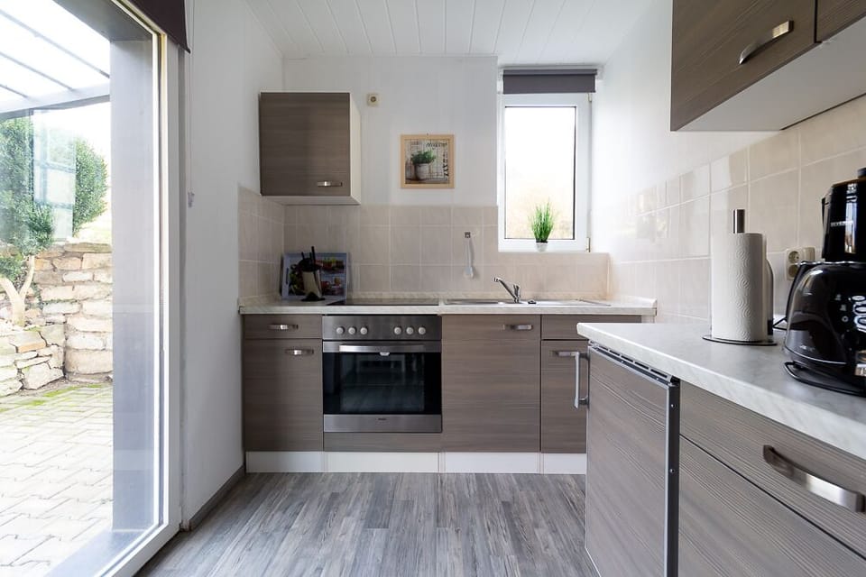 Family Condo | Private kitchen | Fridge, stovetop, electric kettle, toaster