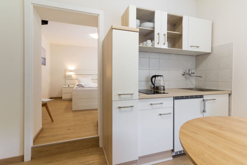 Fridge, stovetop, electric kettle, toaster