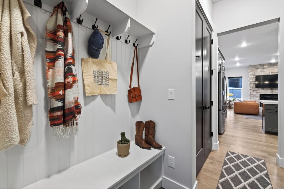 Welcome home with this thoughtfully designed entryway, featuring built-in hooks and bench seating—perfect for ski gear, boots, and everyday essentials after a day in Park City.