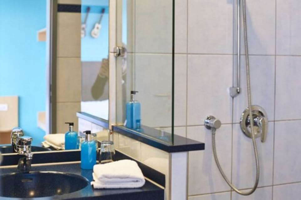 Shower, eco-friendly toiletries, hair dryer, towels