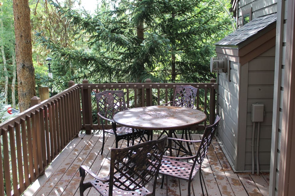 Deck - Private and spacious, the deck is tucked behind the home, offering a peaceful retreat surrounded by tall pines and natural beauty.