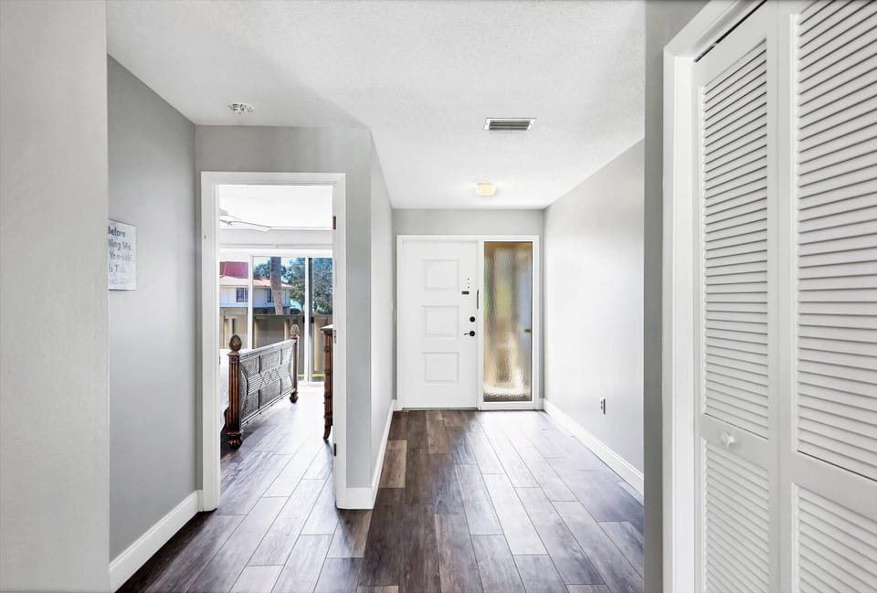 Step into your private entryway with gleaming hardwood floors and bright, airy spaces that welcome you home.
