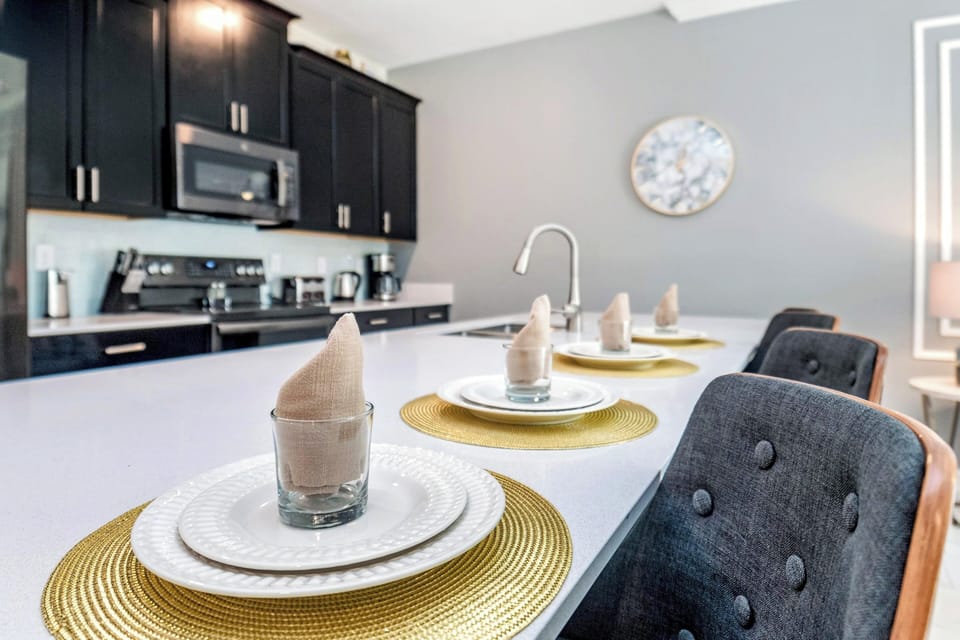 Enjoy the luxurious kitchen and breakfast island seating for four.