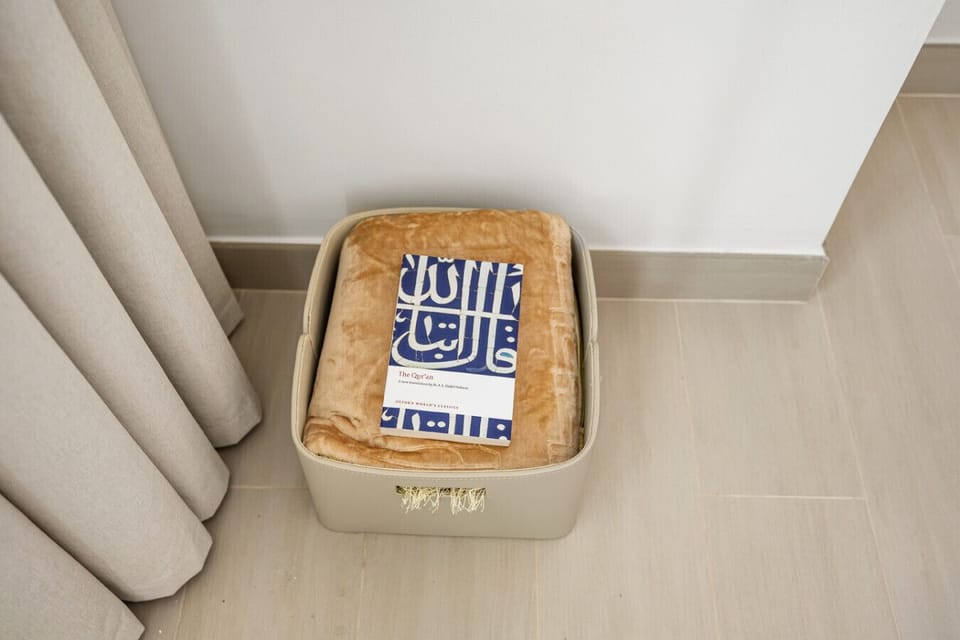 A thoughtfully provided praying mat and Qur`an for your spiritual comfort.