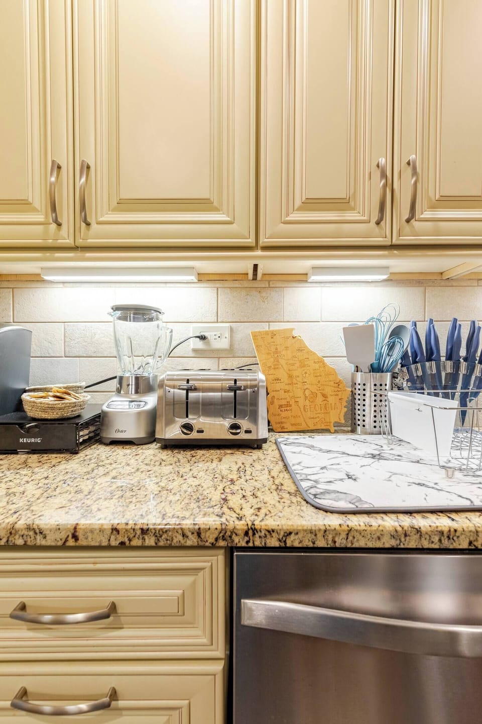 Sleek kitchen w/ modern cabinets & ample counter space for easy meals.