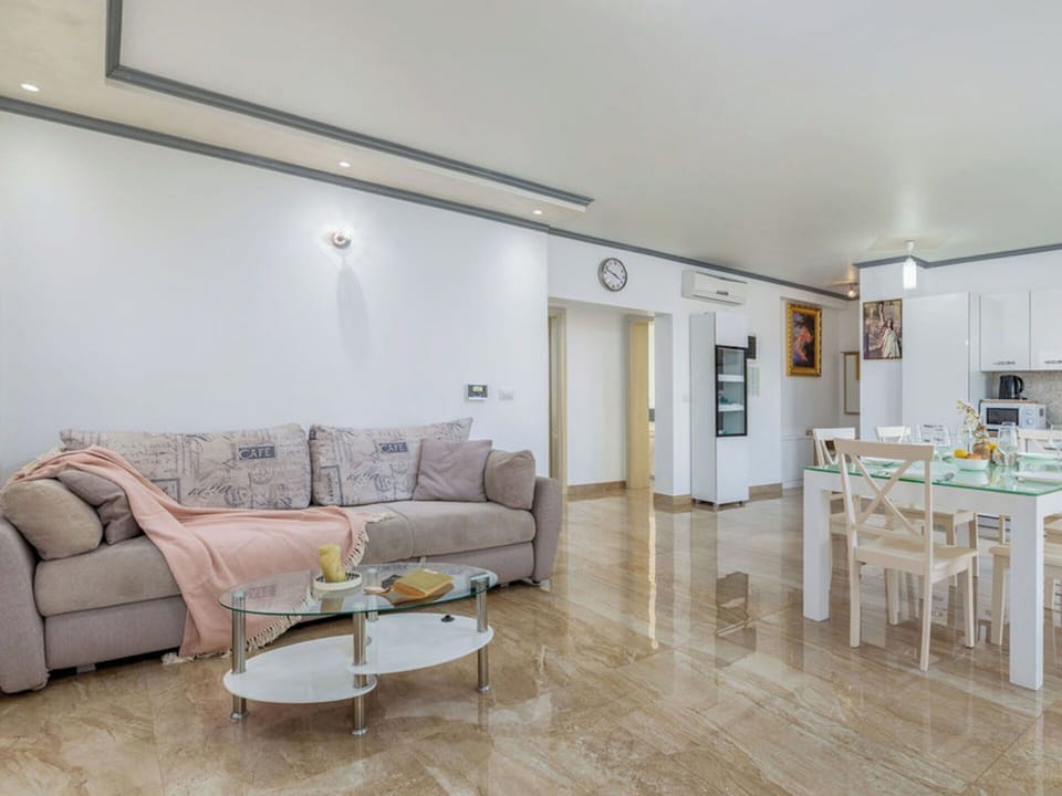 Flooring, Interior Design, Floor, Furniture, Ceiling, Wood, Couch, Room, Lighting, Table