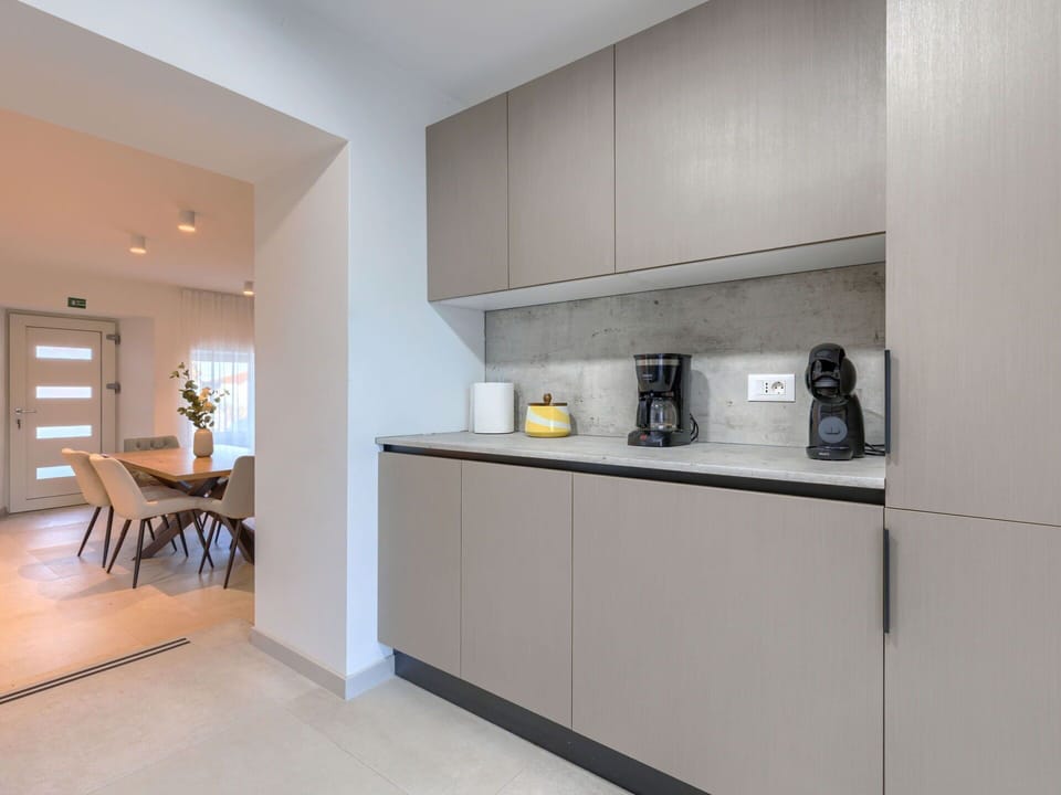 Interior Design, Cabinetry, Kitchen, Countertop, Flooring, Furniture, Wood, Kitchen Appliance, Floor, Cupboard