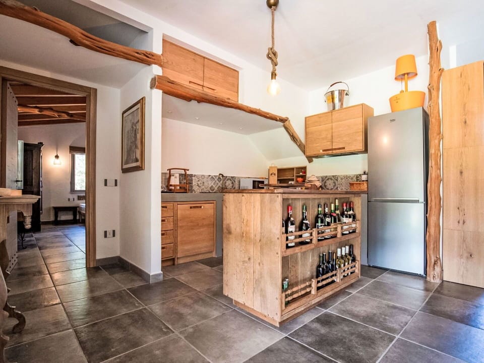Furniture, Kitchen, Interior Design, Countertop, Flooring, Cabinetry, Wood, Ceiling, Floor, Room