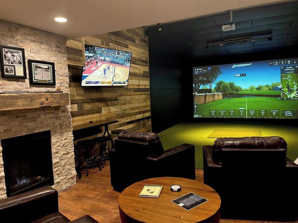 Private golf bay at Oak & Iron Golf + Provisions below The Loft.