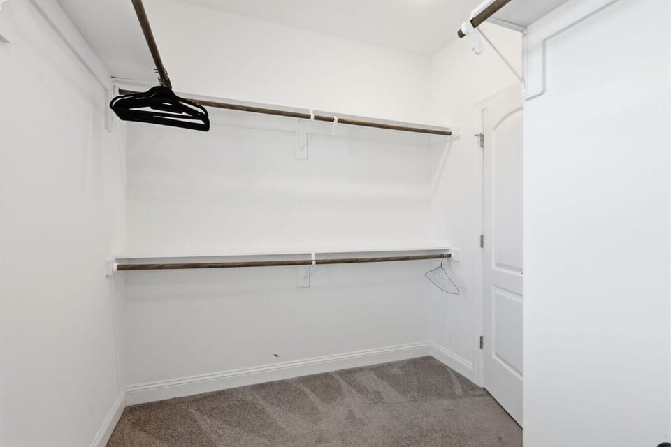 Spacious walk-in closet provides plenty of storage space for clothing, luggage, and vacation essentials