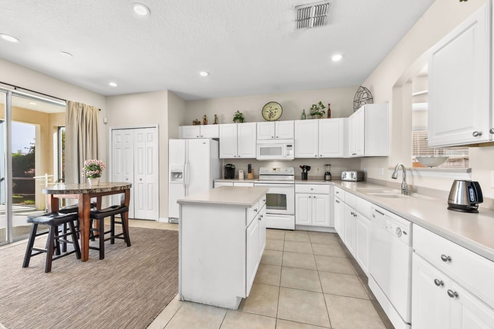 KITCHEN:  Fully Equipped Kitchen with Coffee Maker, Blender, Cookware, Dinnerware, Drinkware and Flatware