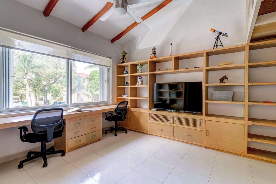 Catch up on work in the dedicated office space with a large desk and entertainment.