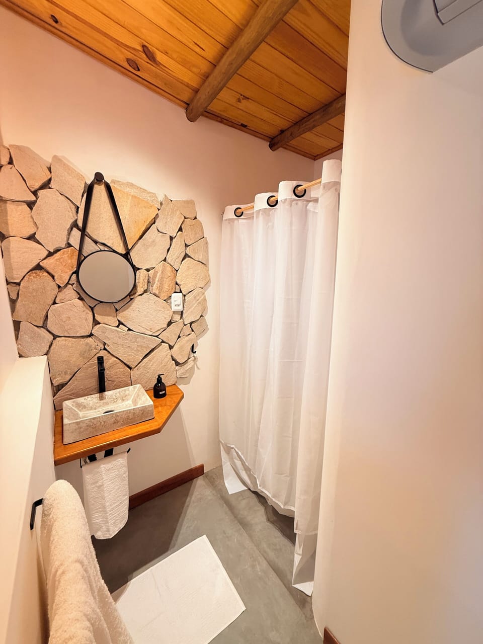 Separate tub and shower, towels, soap, shampoo