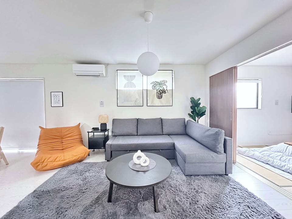 Living room with sofa and seating area.