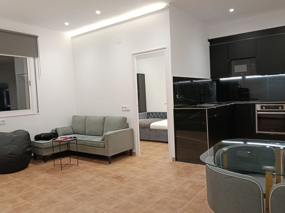 Comfort Apartment, 2 Bedrooms, Garden View | Living area | Flat-screen TV, fireplace