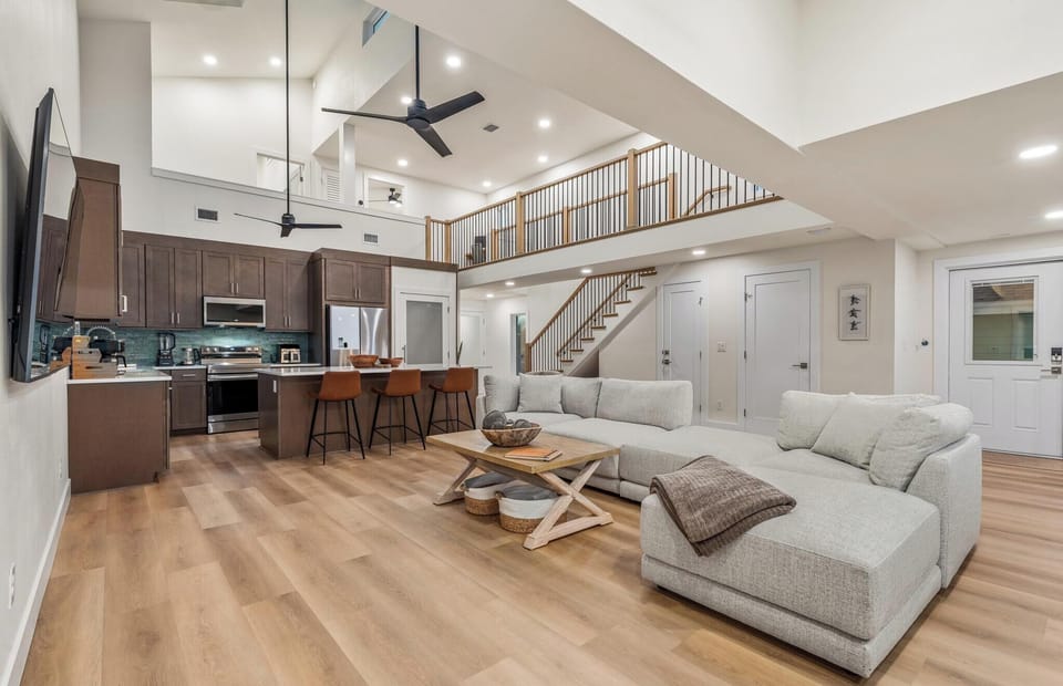 Open concept living with easy access. Half bath under the stairs.