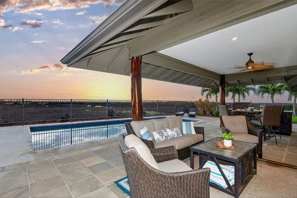 Enjoy stunning sunsets on the large covered Lanai and even watch your favorite games and music outside!
