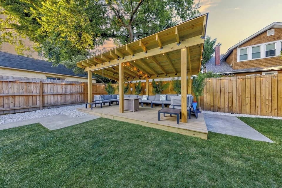 Backyard cabana w/ shade cover & seating, ideal for lounging in the fresh air